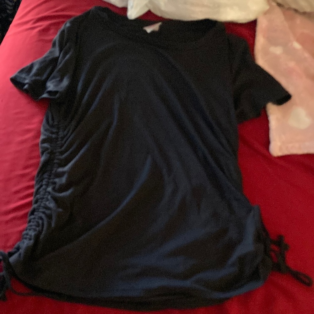 black shirt with ribbons atbthe bottom that can be undone!